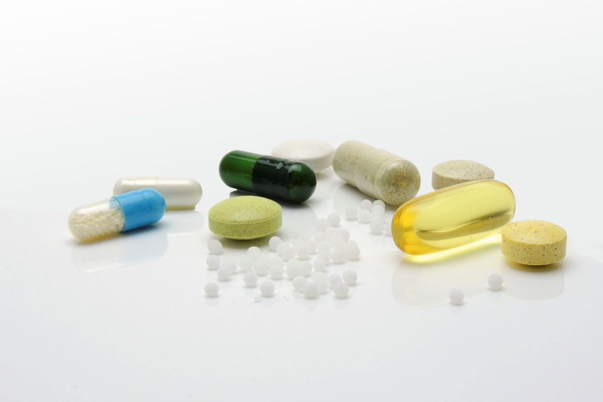 Random size and shaped medical pills on a table